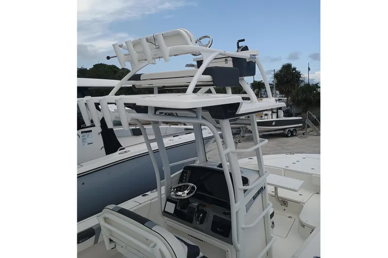 266 -105 Yacht Photos Pics 2023 Robalo 266 Cayman SD boat with elevated helm station and sleek design.