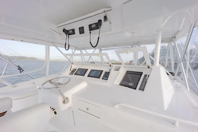 Tam Tam Yacht Photos Pics 1997 Viking 58 Convertible yacht helm with modern navigation equipment.