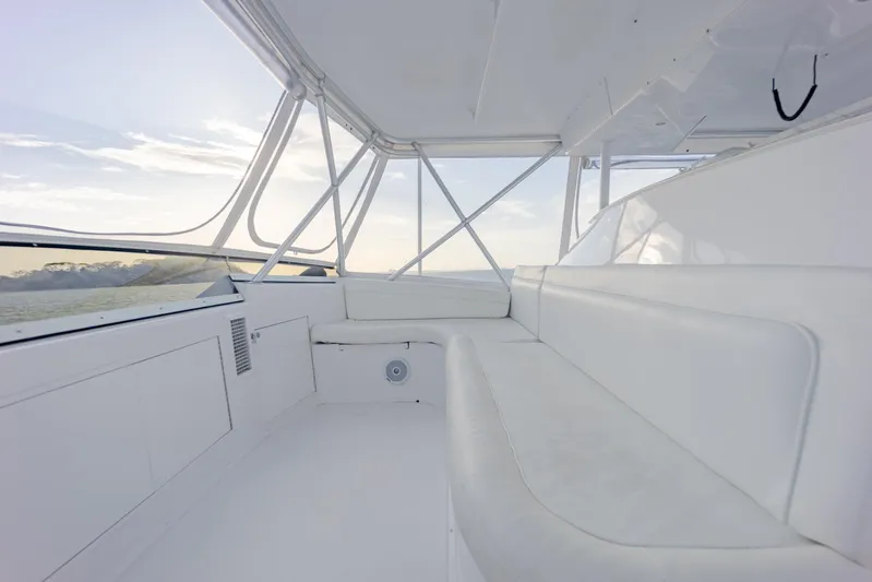 Tam Tam Yacht Photos Pics 1997 Viking 58 Convertible yacht interior with white seating and panoramic windows.