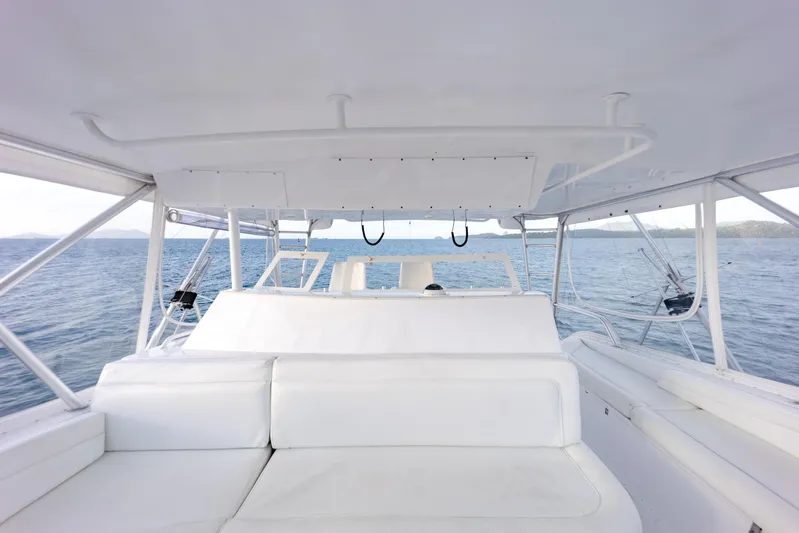 Tam Tam Yacht Photos Pics 1997 Viking 58 Convertible yacht interior with white seating and ocean view.