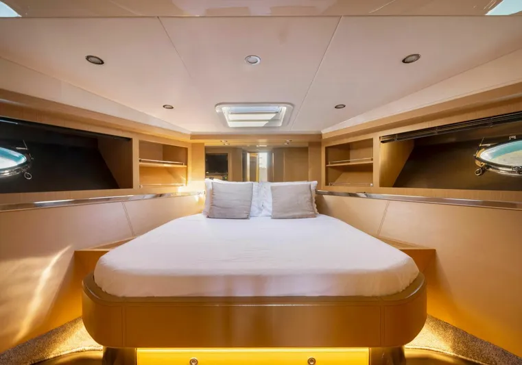  Yacht Photos Pics Luxurious cabin interior of 2009 Riva Sportriva yacht with elegant bedding and ambient lighting.