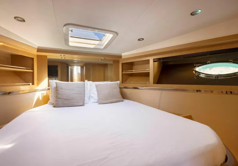  Yacht Photos Pics Luxurious cabin interior of 2009 Riva Sportriva yacht with skylight and cozy bedding.