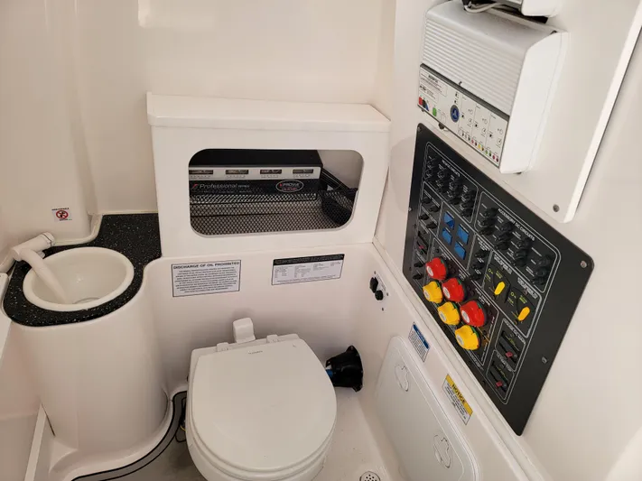  Yacht Photos Pics 2020 Sea Fox 288 Commander boat interior with toilet and control panel.