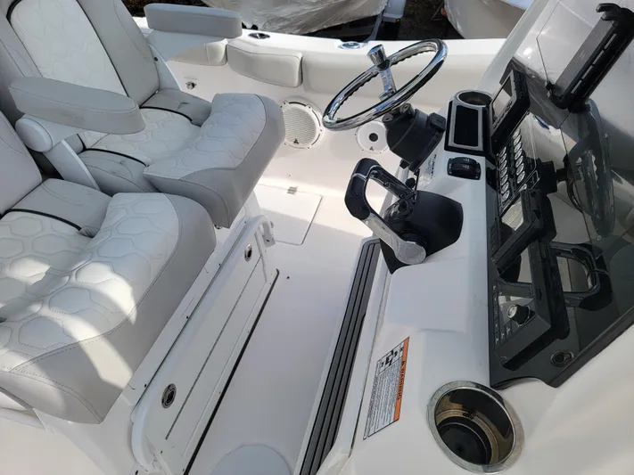  Yacht Photos Pics 2020 Sea Fox 288 Commander boat cockpit with dual captain's chairs and modern controls.