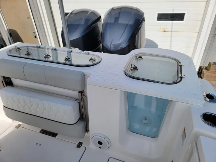  Yacht Photos Pics 2020 Sea Fox 288 Commander boat with dual outboard engines and seating area.