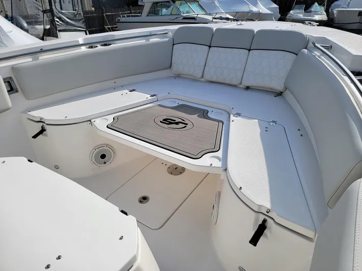  Yacht Photos Pics 2020 Sea Fox 288 Commander boat interior with cushioned seating and storage compartments.