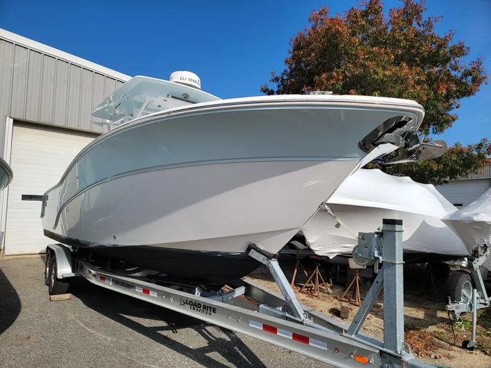  Yacht Photos Pics 2020 Sea Fox 288 Commander boat on trailer outside storage facility.