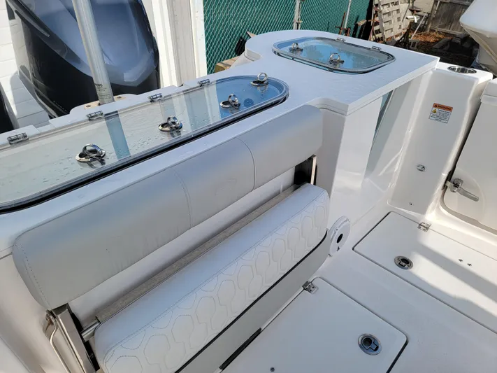  Yacht Photos Pics 2020 Sea Fox 288 Commander boat interior with seating and storage compartments.