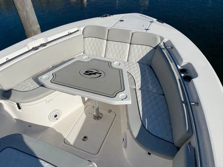  Yacht Photos Pics 2020 Sea Fox 288 Commander boat with cushioned seating and table.