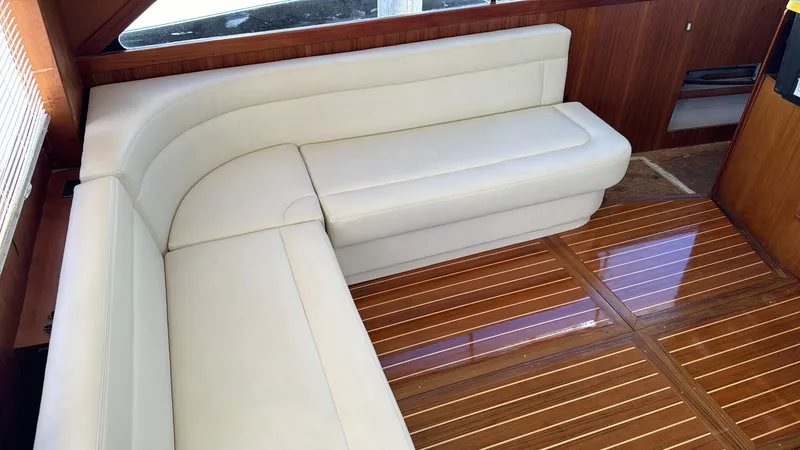  Yacht Photos Pics Interior of 1997 Ocean Yachts 40 Super Sport with white leather seating and wooden flooring.