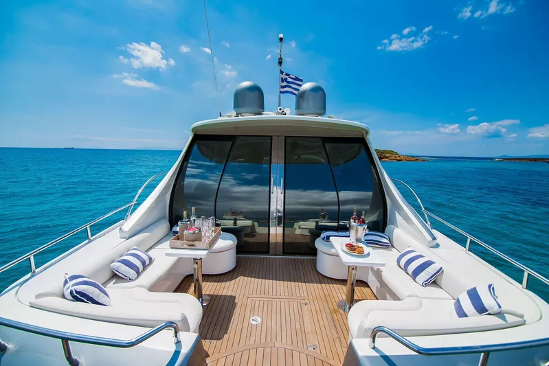  Yacht Photos Pics Luxury Pershing 65 yacht deck with seating, ocean view, and blue sky, 2003 model.