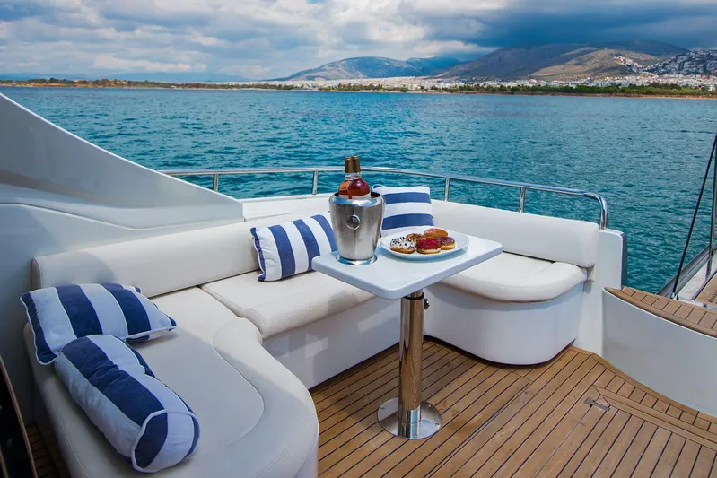  Yacht Photos Pics Luxury seating area on 2003 Pershing 65 yacht with ocean view and refreshments.