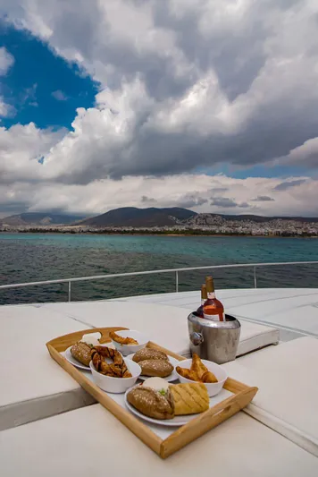  Yacht Photos Pics Luxury dining on a Pershing 65 yacht with scenic ocean view, 2003 model.