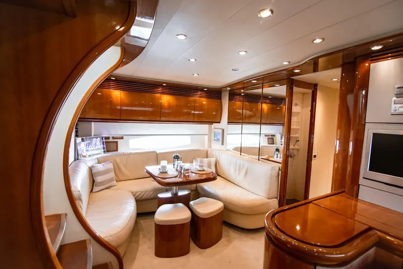  Yacht Photos Pics Luxurious interior of a 2003 Pershing 65 yacht with elegant wood finishes.