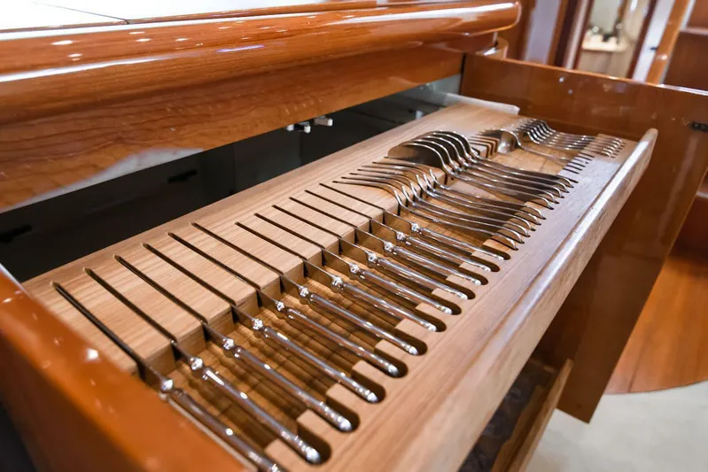  Yacht Photos Pics Luxury yacht Pershing 65 (2003) with elegant wooden cutlery drawer.