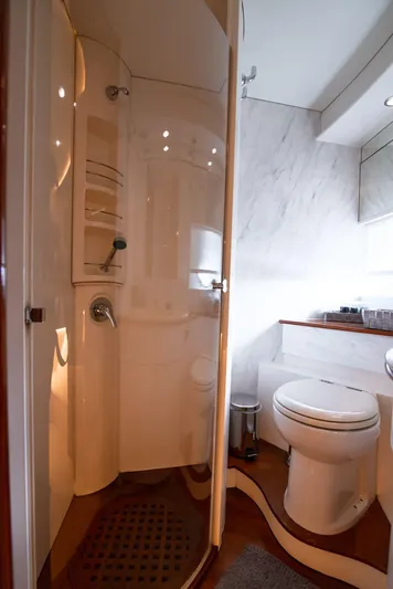  Yacht Photos Pics Bathroom interior of 2003 Pershing 65 yacht with shower and toilet.