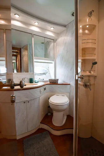  Yacht Photos Pics Luxurious bathroom in a 2003 Pershing 65 yacht with modern fixtures and elegant design.