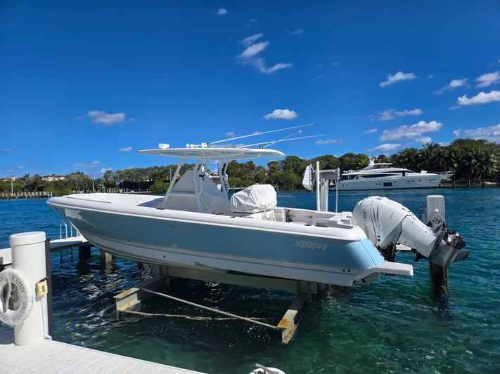  Yacht Photos Pics 2019 Intrepid 327 boat docked on a sunny day.
