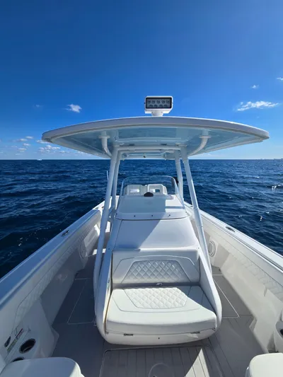  Yacht Photos Pics 2019 Intrepid 327 boat on open sea under clear sky.