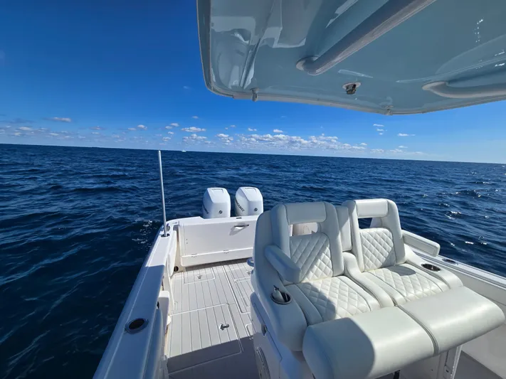  Yacht Photos Pics 2019 Intrepid 327 boat on open sea under clear sky.