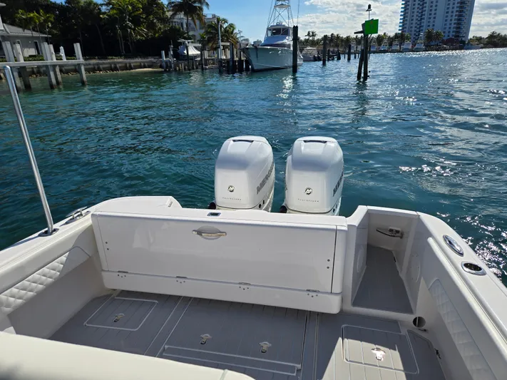  Yacht Photos Pics 2019 Intrepid 327 boat with twin outboard engines on water.