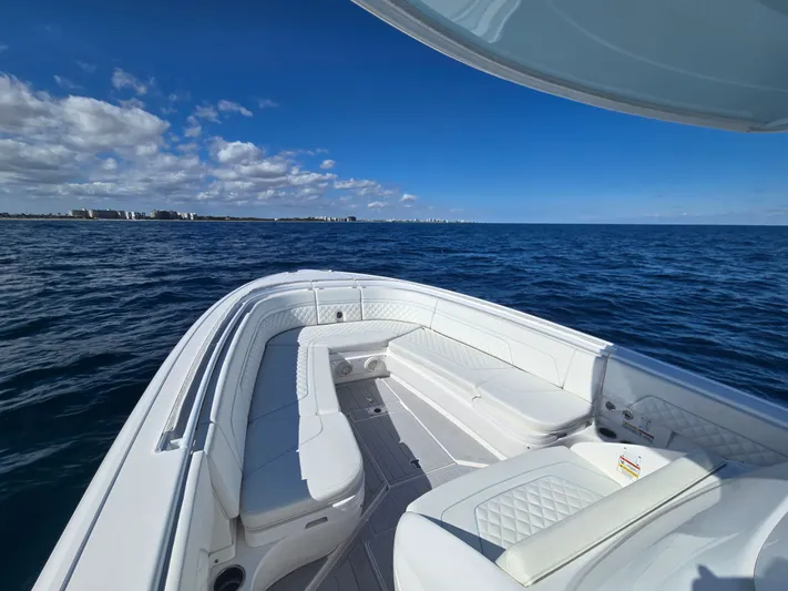  Yacht Photos Pics Intrepid 327 boat from 2019 on open sea under clear sky.