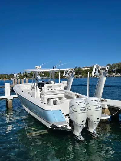  Yacht Photos Pics 2019 Intrepid 327 boat with twin Mercury 350 engines at dock.