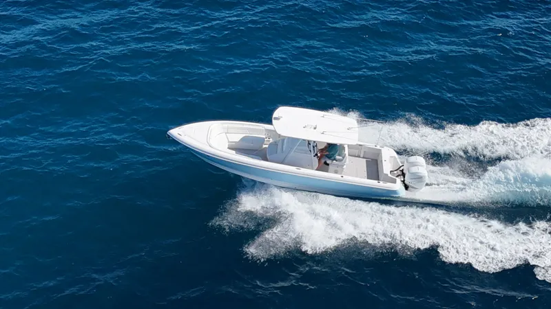  Yacht Photos Pics Aerial view of a 2019 Intrepid 327 boat on the ocean.