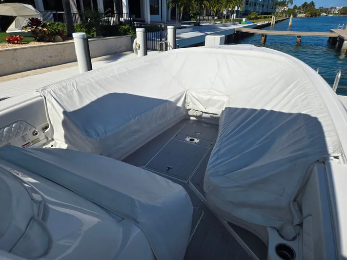  Yacht Photos Pics 2019 Intrepid 327 boat with cushioned seating at the dock.