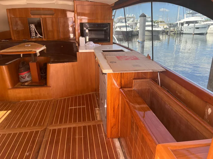  Yacht Photos Pics Interior of a 1997 Ocean Yachts 40 Super Sport with wooden flooring and marina view.