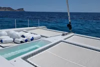 Luxurious 2023 Custom 22m Catamaran with netted deck and ocean view.
