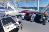 Control panel of a 2023 Custom 22m Catamaran with ocean view.