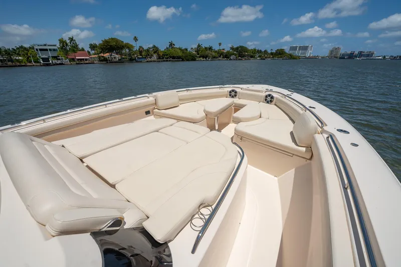  Yacht Photos Pics 2019 Grady-White Canyon 456 boat with spacious seating on a sunny day.
