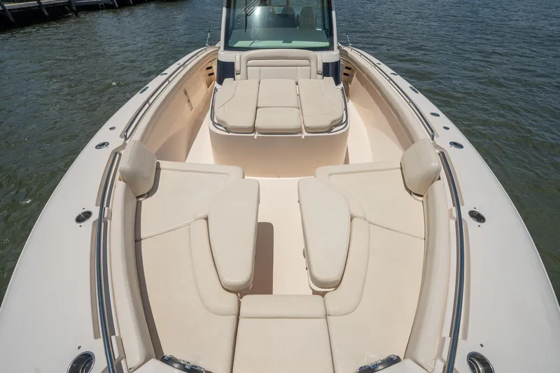  Yacht Photos Pics 2019 Grady-White Canyon 456 boat with spacious seating on calm water.