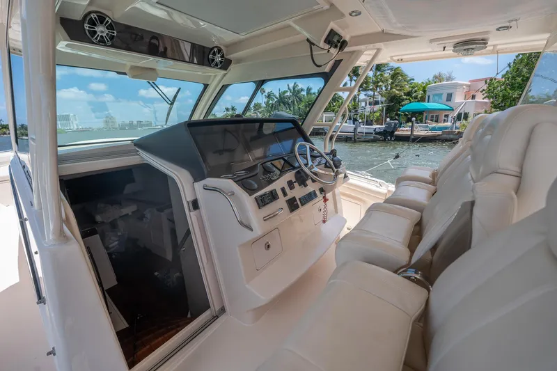  Yacht Photos Pics 2019 Grady-White Canyon 456 boat interior with luxurious seating and modern dashboard.