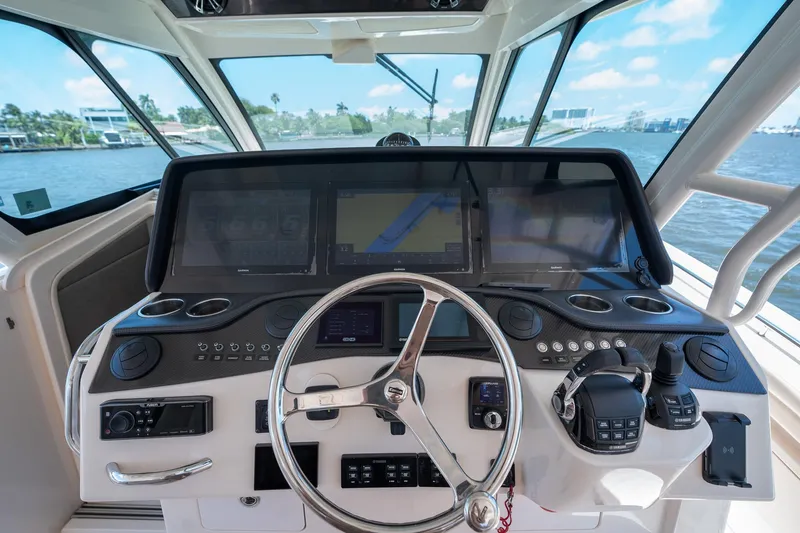  Yacht Photos Pics 2019 Grady-White Canyon 456 helm with advanced navigation systems and steering wheel.