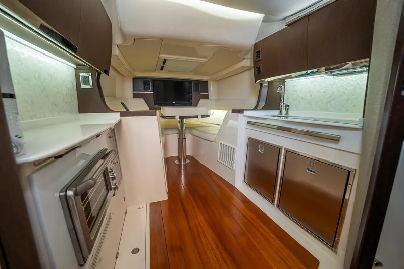  Yacht Photos Pics Luxurious interior of 2019 Grady-White Canyon 456 boat with modern kitchen amenities.