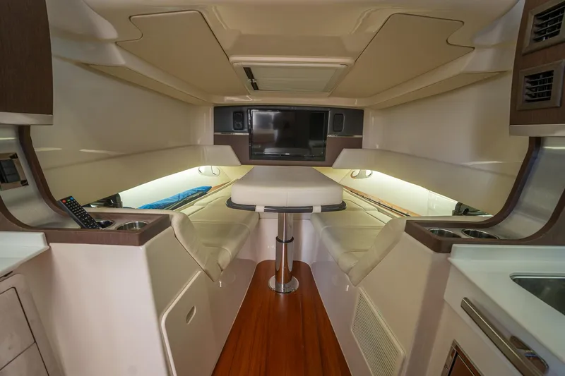  Yacht Photos Pics 2019 Grady-White Canyon 456 interior with seating, table, and modern amenities.