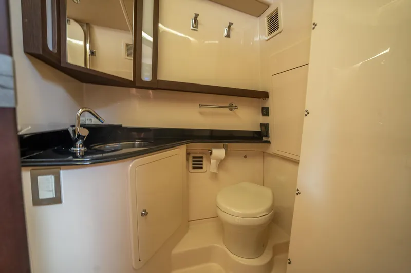  Yacht Photos Pics Luxurious bathroom in 2019 Grady-White Canyon 456 boat with modern fixtures and cabinetry.