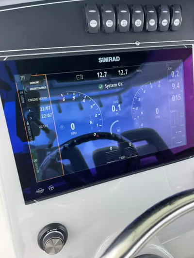  Yacht Photos Pics Simrad display on 2025 Boston Whaler 330 Outrage showing engine metrics and system status.