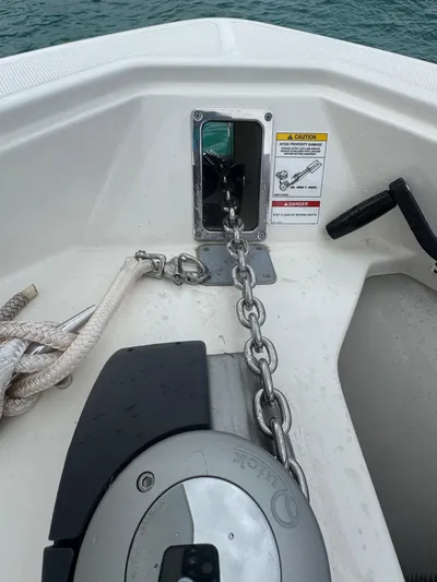  Yacht Photos Pics 2025 Boston Whaler 330 Outrage anchor chain and winch system on deck.