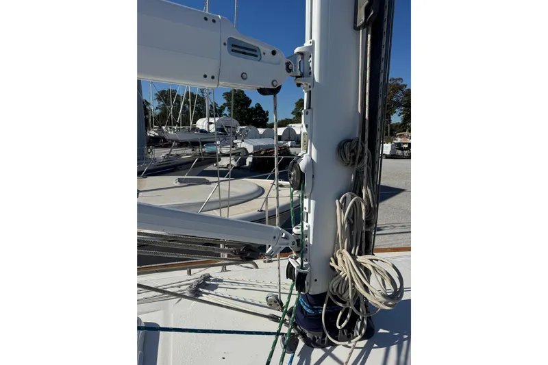 Lady Slipper Yacht Photos Pics Mast and rigging of a 2005 Sabre 386 sailboat in a marina setting.