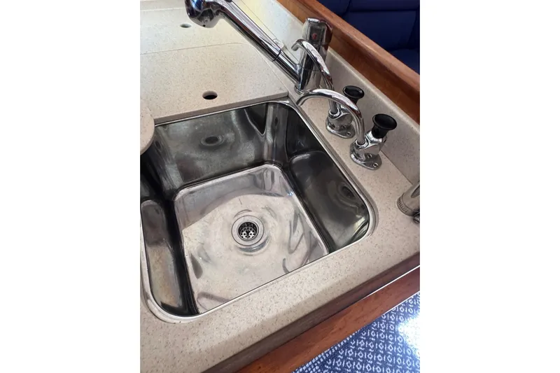 Lady Slipper Yacht Photos Pics Stainless steel sink with faucet in 2005 Sabre 386 yacht kitchen.