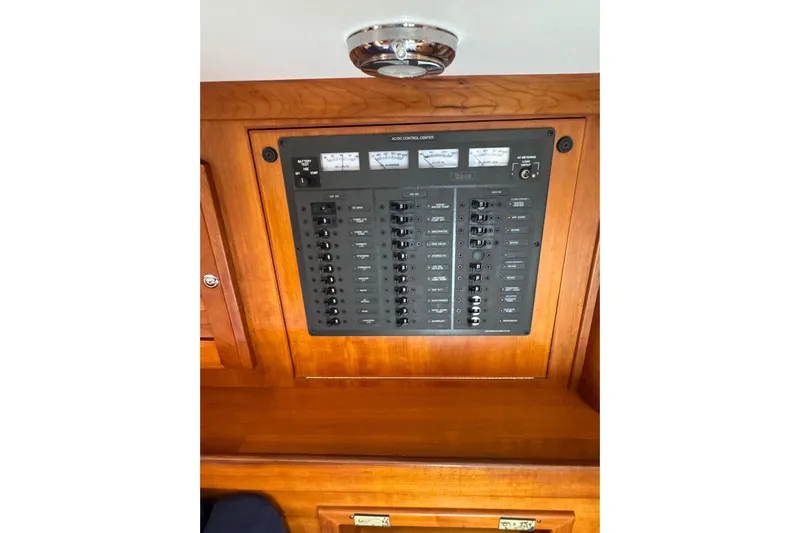 Lady Slipper Yacht Photos Pics Electrical control panel on a 2005 Sabre 386 yacht, featuring multiple switches and gauges.