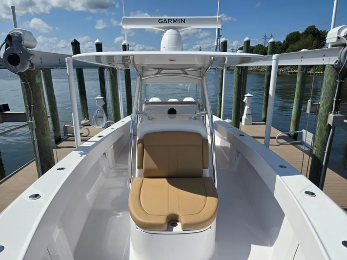  Yacht Photos Pics 2025 Bahama 35 Super Center Console boat docked, featuring tan seating and Garmin equipment.