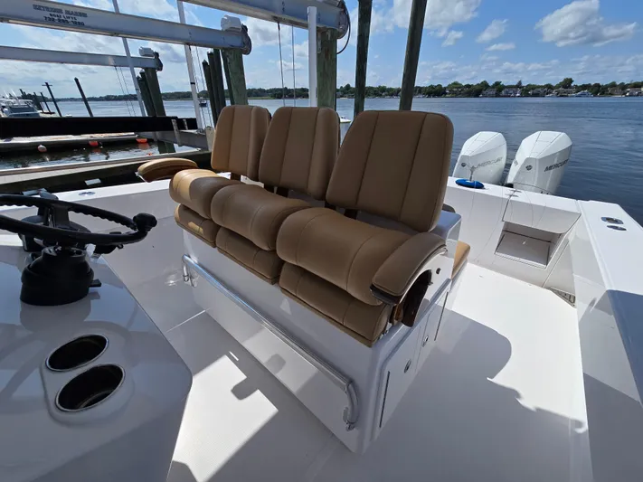  Yacht Photos Pics 2025 Bahama 35 Super Center Console boat with tan seating and dual Mercury engines.