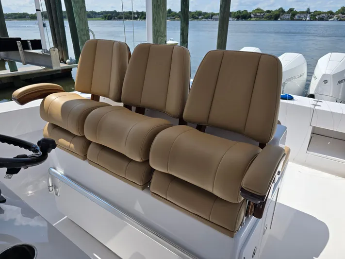  Yacht Photos Pics 2025 Bahama 35 Super Center Console boat with tan seating, docked by the water.
