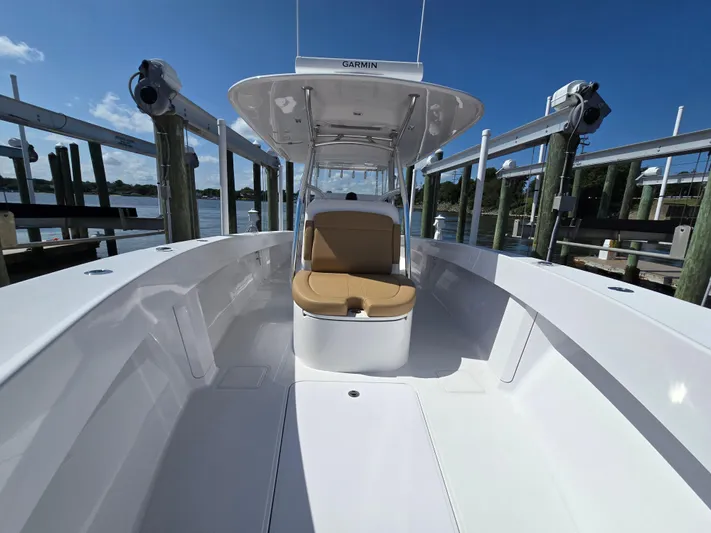  Yacht Photos Pics 2025 Bahama 35 Super Center Console boat docked, featuring sleek design and spacious seating.