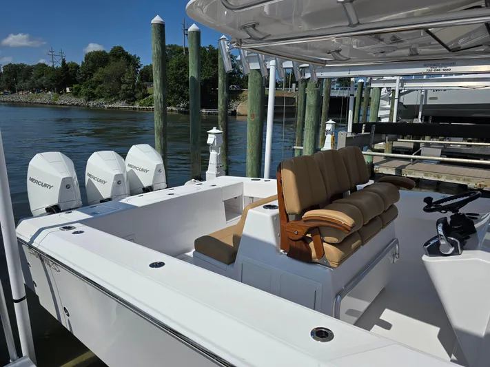  Yacht Photos Pics 2025 Bahama 35 Super Center Console boat with triple Mercury engines docked.