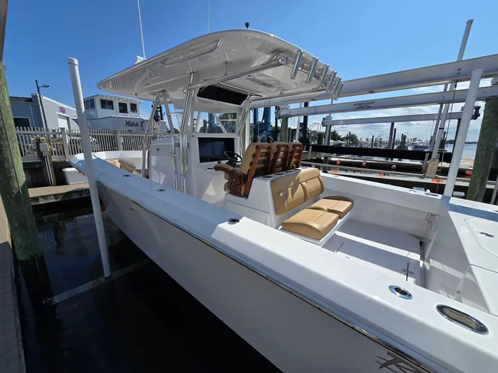  Yacht Photos Pics 2025 Bahama 35 Super Center Console boat docked, featuring sleek design and spacious seating.